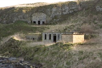 General view of engine room, oil store and SAA store in cliff from WSW, Inchkeith.
