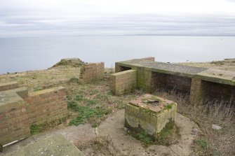 Detail of raised holdfast and ready use ammunition lockers from NW.