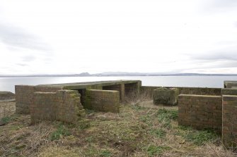 View of raised holdfast and ready use ammunition lockers from E.