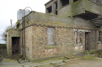 Detail of brick ground floor (earlier ?) from NW.