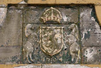 Detail of the Royal Coat of Arms dated 1564 on archway adjacent to the lighthouse from WNW.