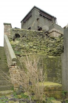 View of possible surviving section of 16th century wall below  the Port War Signal Station from the SW.