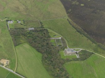 Oblique aerial view centred on the house and gardens, taken from the SSE.