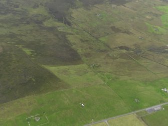 General oblique aerial view of the remains of the farmsteads around Kingarly on Rousay, taken from the E.