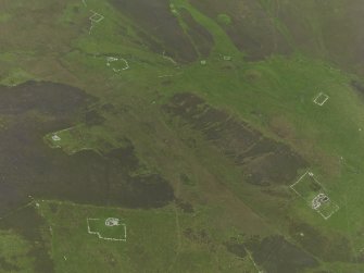 Oblique aerial view centred on the remains of the farmsteads, field systems and head dykes, taken from the N.