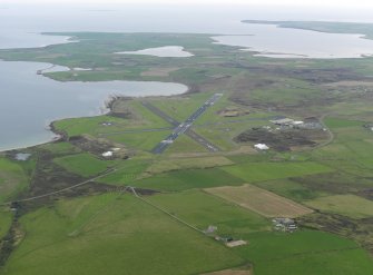 General oblique aerial view centred on the airport, taken from the SW.