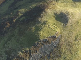 Oblique aerial view centred on the remains of the fort, taken from the WNW.