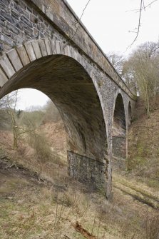View of arches of road bridge, Torwoodlee, from NNE above the railway