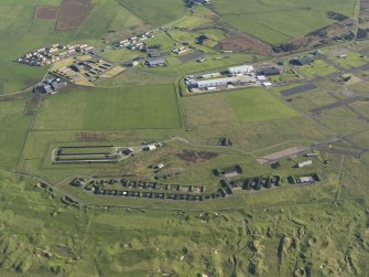 Oblique aerial view of the bomb stores at Machrihanish Airfield, taken from the WNW.