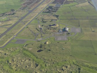 Oblique aerial view of the hangar at Machrihanish Airfield, taken from the SW.