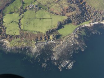 Oblique aerial view of the dun at Rubha nan Sgarbh and the farmstead at Whitestone, taken from the ESE.