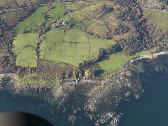Oblique aerial view of the dun at Rubha nan Sgarbh and the farmstead at Whitestone, taken from the E.