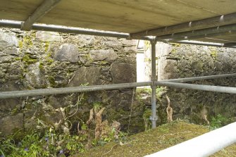 S wall. Infilled window arch. Detail