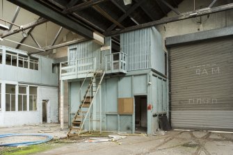 Interior, main hall showing mezzanine floor store with room below.