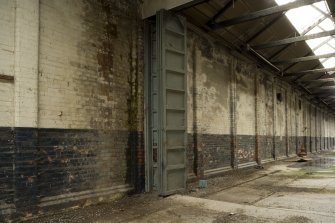 Interior, detail of inner folding doors between later extension and original building.