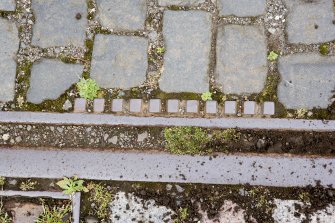 Detail of tram track in setts at W end of depot.