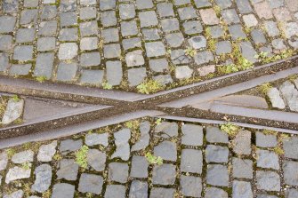 Detail of tram track crossover in setts at W end of depot.