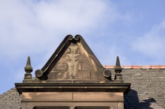 Detail of pediment above second floor window from S.