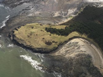 Oblique aerial view centred on the remains of the cairn with the WW II trench system adjacent, taken from the WNW.