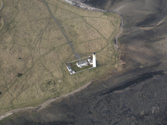 Oblique aerial view centred on the lighthouse with the keepers cottages adjacent, taken from the E.