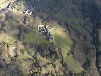 Oblique aerial view centred on the country house, taken from the SW.