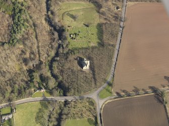 Oblique aerial view centred on the church with the remains of St Dionysius adajacent, taken from the SW.