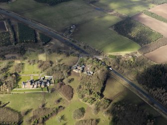 General oblique aerial view centred on the country house, taken from the SE.