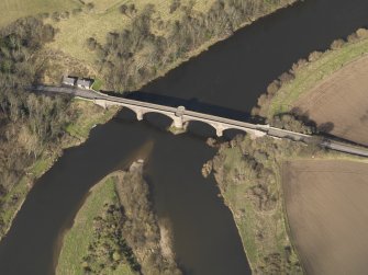 Oblique aerial view centred on the bridge with the toll house adjacent, taken from the S.