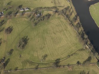Oblique aerial view centred on the remains of rig and furrow cultivation with the East Lodge adjacent, taken from the SSE.