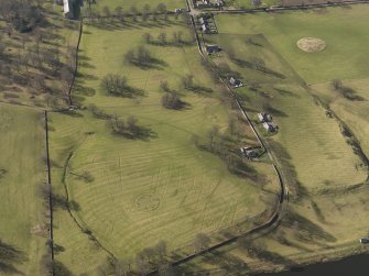Oblique aerial view centred on the village with the remains of rig and furrow cultivation adjacent, taken from the ENE.
