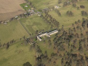 Oblique aerial view centred on the Riding Stables, taken from the SW.