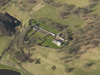 Oblique aerial view centred on the New Ladykirk House, taken from the SE.