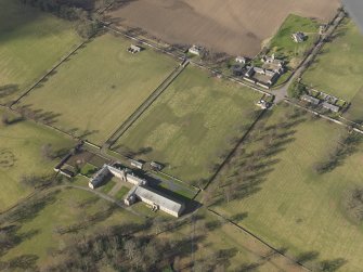 Oblique aerial view centred on the Riding Stables, taken from the SE.