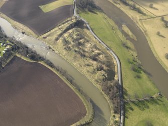 Oblique aerial view centred on the remains of the castle, taken from the NE.