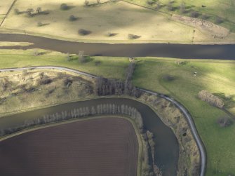 Oblique aerial view centred on the remains of the E end of the castle, taken from the SE