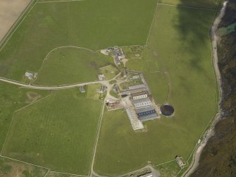Oblique aerial view centred on the Hall of Tankerness with the farmstead and burial ground adjacent, taken from the SW.
