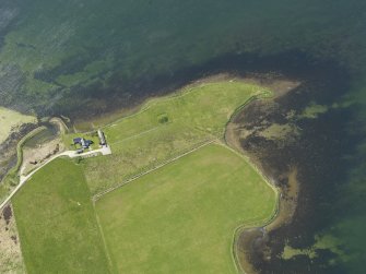 Oblique aerial view centred on the Knowe of Onston chambered cairn, taken from the E.