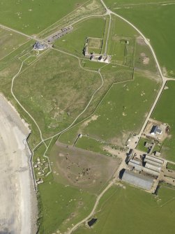 General olique aerial view centred on Skara Brae with Skaill House and farm adjacent, taken from the W.