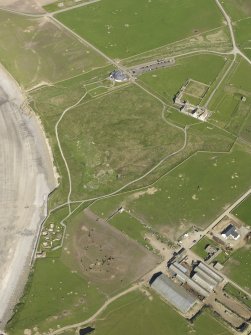 General oblique aerial view centred on Skara Brae with Skaill House and farm adjacent, taken from the W.