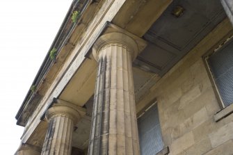 Detail. View looking up to column capitals and panelled ceiling space, main entrance portico