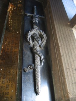 View of relief sculpture of sword.