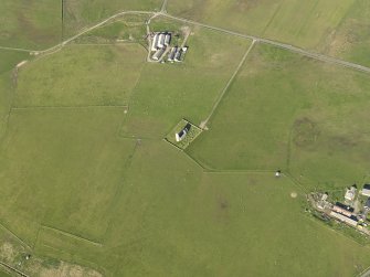 Oblique aerial view centred on St Magnus' Church and burial ground, taken from the WSW.