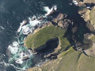 Oblique aerial view centred on the remains of the fort at Brough of Bigging, taken from the S.