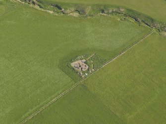 Oblique aerial view centred on the excavation at the Cairns o' the Bu settlement at Windwick, taken from the SSE.