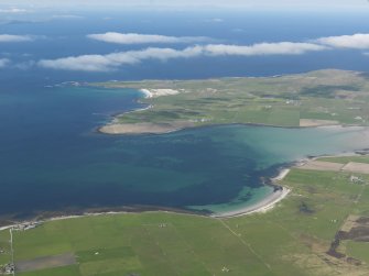 General oblique aerial view looking across the Bay of Tuqouy, taken from the NE.