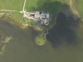 Oblique aerial view centred on a site of possible occupation at Burness with Burness farmstead adjacent, taken from the S.