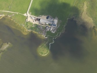 Oblique aerial view centred on a site of possible occupation at Burness with Burness farmstead adjacent, taken from the S.