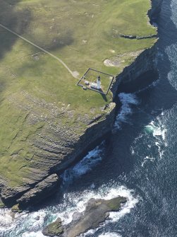 Oblique aerial view centred on Noup Head lighthouse, taken from the NW.