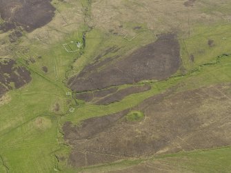Oblique aerial view centred on the Knowe of Dale burnt mound, taken from the W.