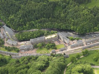 Oblique aerial view of New Lanark centred on the roof garden, taken from the NE.